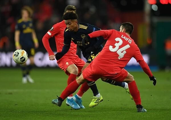 Reiss Nelson Darts Past Kostas Laifis: Arsenal's Europa League Battle at Standard Liege