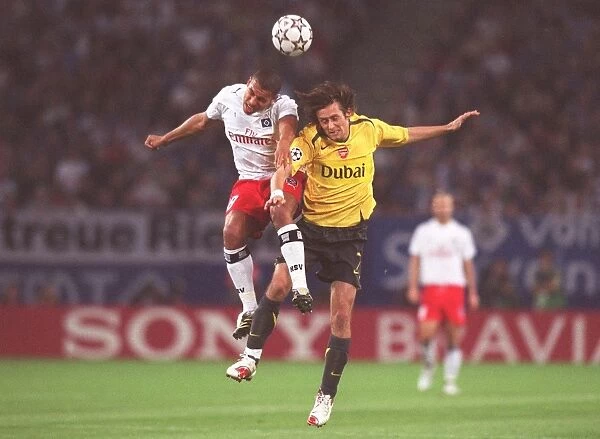 Rosicky and De Jong Clash: Hamburg vs. Arsenal in UEFA Champions League