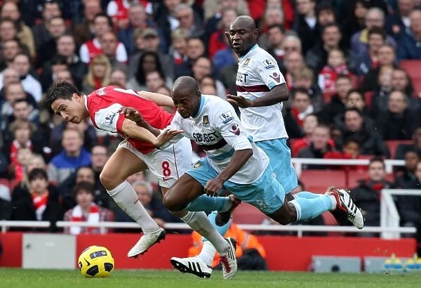 Samir Nasri (Arsenal) Luis Boa Morte and Henrita Ilunga (West Ham). Arsenal 1