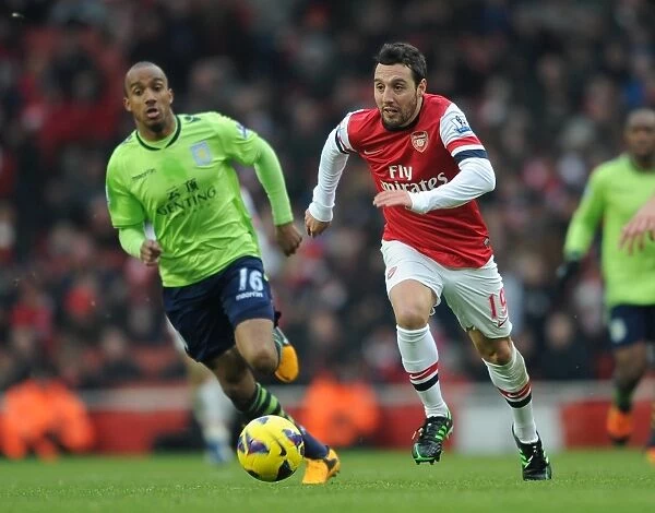 Santi Cazorla (Arsenal) Fabian Delph (Villa). Arsenal 2: 1 Aston Villa. Barclays Premier League