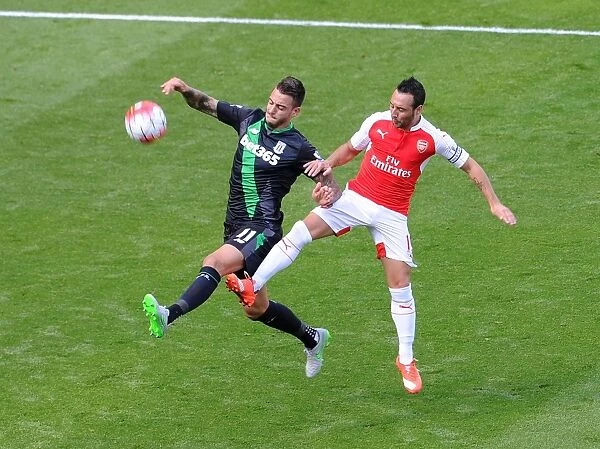 Santi Cazorla vs. Mato Joselu: Intense Battle in Arsenal's Victory over Stoke City