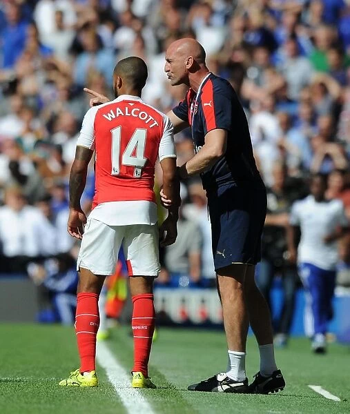 Steve Bould Coaches Theo Walcott: Arsenal's Assistant Manager Gives Instructions During Chelsea vs. Arsenal (2015-16 Premier League)