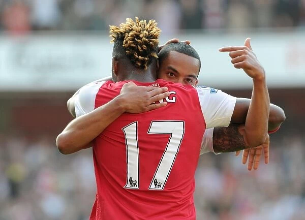 Theo Walcott and Alex Song Celebrate Arsenal's 3-0 Victory over Aston Villa in the Premier League