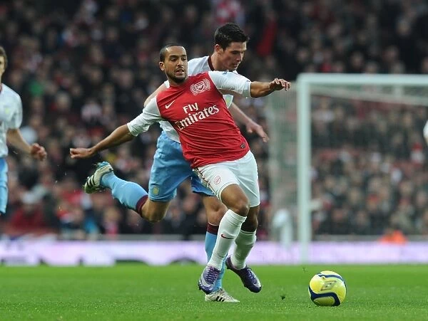Theo Walcott Breaks Past Aston Villa's Ciaran Clark in FA Cup Fourth Round Clash at Arsenal's Emirates Stadium
