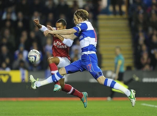 Theo Walcott vs Kaspars Gorkss: Intense Battle in Reading v Arsenal Capital One Cup Clash