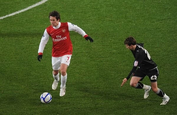 Tomas Rosicky (Arsenal) Thomas Carroll (Orient). Arsenal 5: 0 Leyton Orient