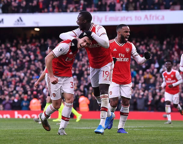 Triumphant Arsenal Trio: Martinelli, Lacazette, and Pepe Celebrate Goal Against Sheffield United (2019-20)