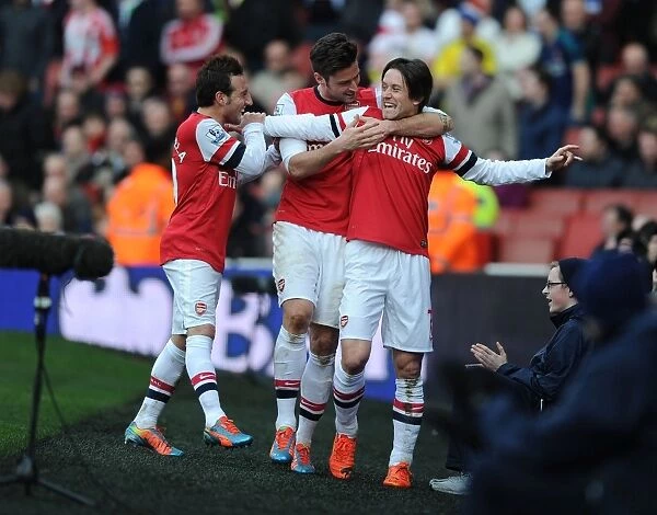 Triumphant Arsenal Trio: Rosicky, Cazorla, and Giroud Celebrate Goals Against Sunderland (2013-14)