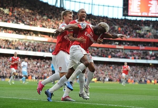Triumphant Threesome: Song, Bendtner, and Clichy Celebrate Arsenal's 1-0 Victory Over West Ham United