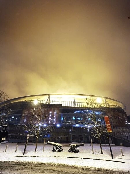Winter's Grip: Arsenal's Emirates Stadium Transformed in Snowy Premier League Battlefield
