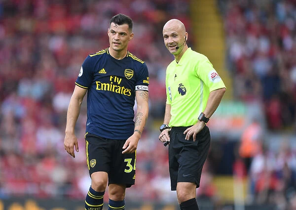 Xhaka and Referee Taylor in Heated Discussion: Liverpool vs. Arsenal, Premier League 2019-20
