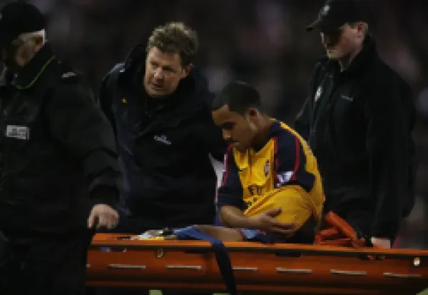 Buy Arsenal's Theo Walcott injured after a challenge by
