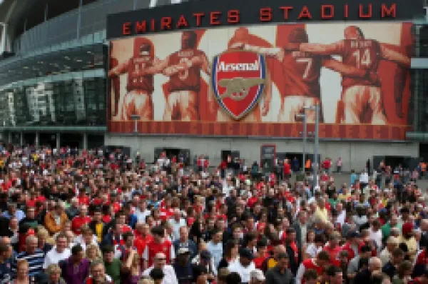 Buy Arsenal fans leave the stadium after the the match