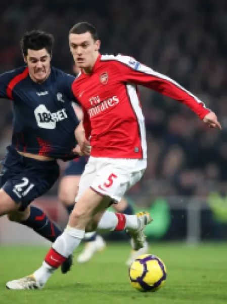 Buy Thomas Vermaelen (Arsenal) holds off Tamir Cohen (Bolton). Arsenal 4:2 Bolton Wanderers. Barclays Premier League. Emirates Stadium, 20/1/10. Credit : Arsenal Football Club / David