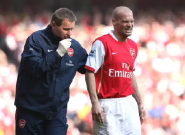 Buy Arsenal physio Gary Lewin treats Freddie Ljungberg