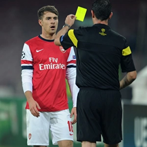 Aaron Ramsey Yellow Carded by Referee Viktor Kassai in Napoli v Arsenal UEFA Champions League Match