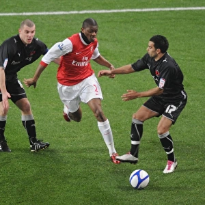 Abou Diaby (Arsenal) Stephen Dawson and Jason Crowe (Orient). Arsenal 5: 0 Leyton Orient