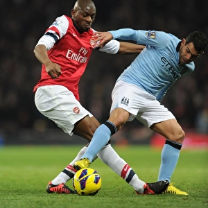 Abou Diaby vs. Carlos Tevez: Intense Tackle in Arsenal vs. Manchester City Premier League Clash (2012-13)