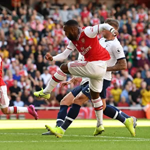 Alexandre Lacazette Scores the Opener: Arsenal Triumphs over Tottenham in Intense Premier League Clash (2019-20)