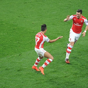 Alexis Sanchez and Mesut Ozil Celebrate Goals: Arsenal FC vs Galatasaray AS, UEFA Champions League, 2014