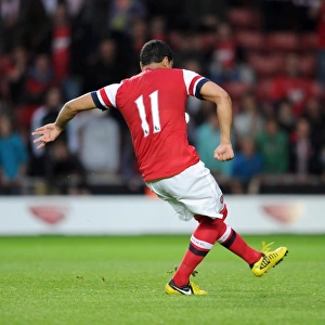 Andre Santos scores for Arsenal from the penalty spot during the shoot out