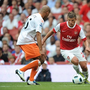 Andrey Arshavin (Arsenal) Alex Baptiste (Blackpool). Arsenal 6: 0 Blackpool