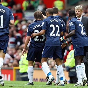 Andrey Arshavin celebrates scoring Arsenals goal with Gael Clichy