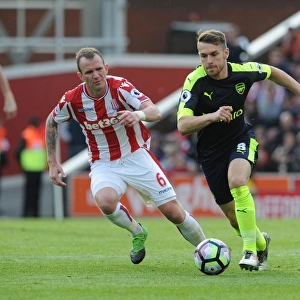 Aron Ramsey vs. Glenn Whelan: Intense Battle in Stoke City vs. Arsenal Premier League Clash