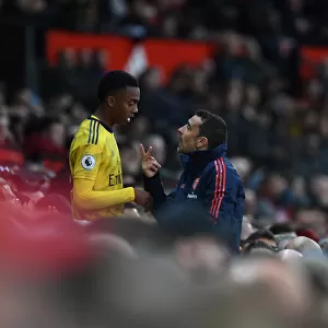 Arsenal Assistant Coach Juan Carlos Cardedo Conferring with Joe Willock during Manchester United vs Arsenal (2019-20)