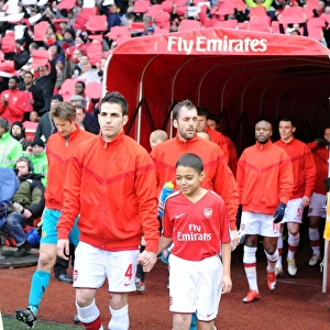 Arsenal captain Cesc Fabregas leads the team out before the match. Arsenal 1