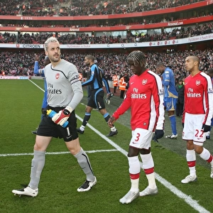 Arsenal captain Manuel Almunia leads out the team