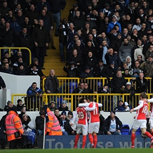 Arsenal Celebrate Mesut Ozil's Goal Against Tottenham Hotspur in the Premier League