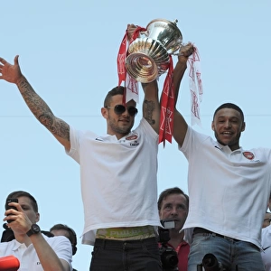 Arsenal Champions: Jack Wilshere and Alex Oxlade-Chamberlain Celebrate Victory on the Trophy Parade, Islington (May 18, 2014)