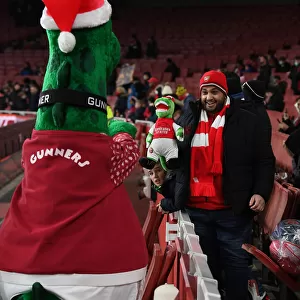 Arsenal Fan's Excitement: Carabao Cup Quarterfinal at Emirates Stadium with Gunnersaurus Statue