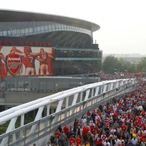 Arsenal fans leave the stadium after the match
