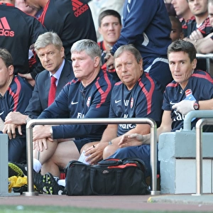 Arsenal manager Arsene Wenger on the bench with physio Colin Lewin, assistant Pat Rice