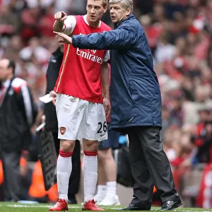 Arsenal manager Arsene Wenger with Nicklas Bendtner during the match