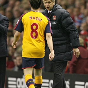 Arsenal manager Arsene Wenger talks with Samir Nasri