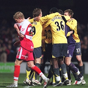 The Arsenal players celebrate winning the penalty shoot out