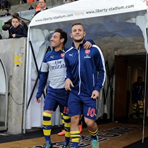 Arsenal Stars Santi Cazorla and Jack Wilshere Warm Up Ahead of Swansea Clash (2014-15)