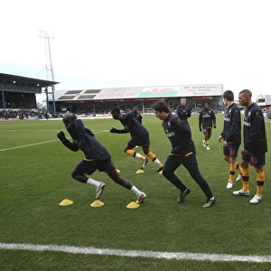 The Arsenal team warm up before the match