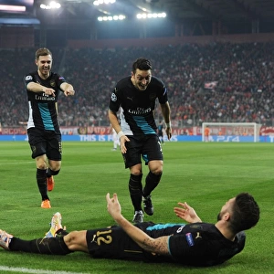 Arsenal Triumph: Giroud, Ozil, Ramsey Celebrate Goals Against Olympiacos in UEFA Champions League (December 2015)