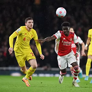 Arsenal vs. Liverpool: Bukayo Saka vs. Andrew Robertson Battle at Emirates Stadium