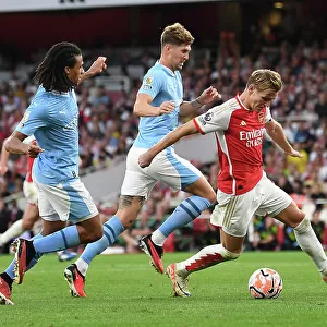Arsenal vs Manchester City: Martin Odegaard Faces Off Against Stones and Ake in Intense Premier League Clash (2023-24)