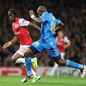 Arsenal vs Marseille: Intense Battle Between Gervinho and Rod Fanni in the 2011-12 UEFA Champions League