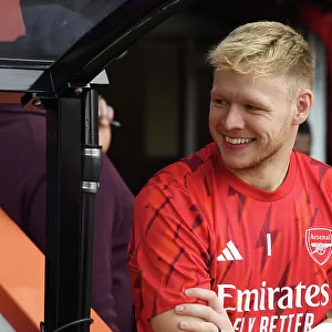 Arsenal's Aaron Ramsdale Smiles on the Bench Before AFC Bournemouth Clash (2023-24)
