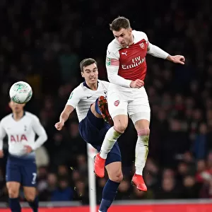 Arsenal's Aaron Ramsey Battles with Tottenham's Harry Winks in Carabao Cup Quarterfinal Showdown