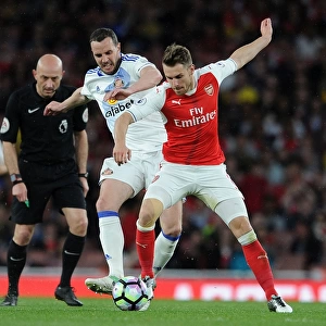 Arsenal's Aaron Ramsey Clashes with Sunderland's John O'Shea during Premier League Match