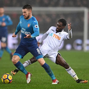 Arsenal's Aaron Ramsey Faces Off Against Swansea's Nathan Dyer in Premier League Clash