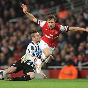 Arsenal's Aaron Ramsey Fouls by Newcastle's Mathieu Debuchy: Intense Moment from the 2013/14 Premier League Match